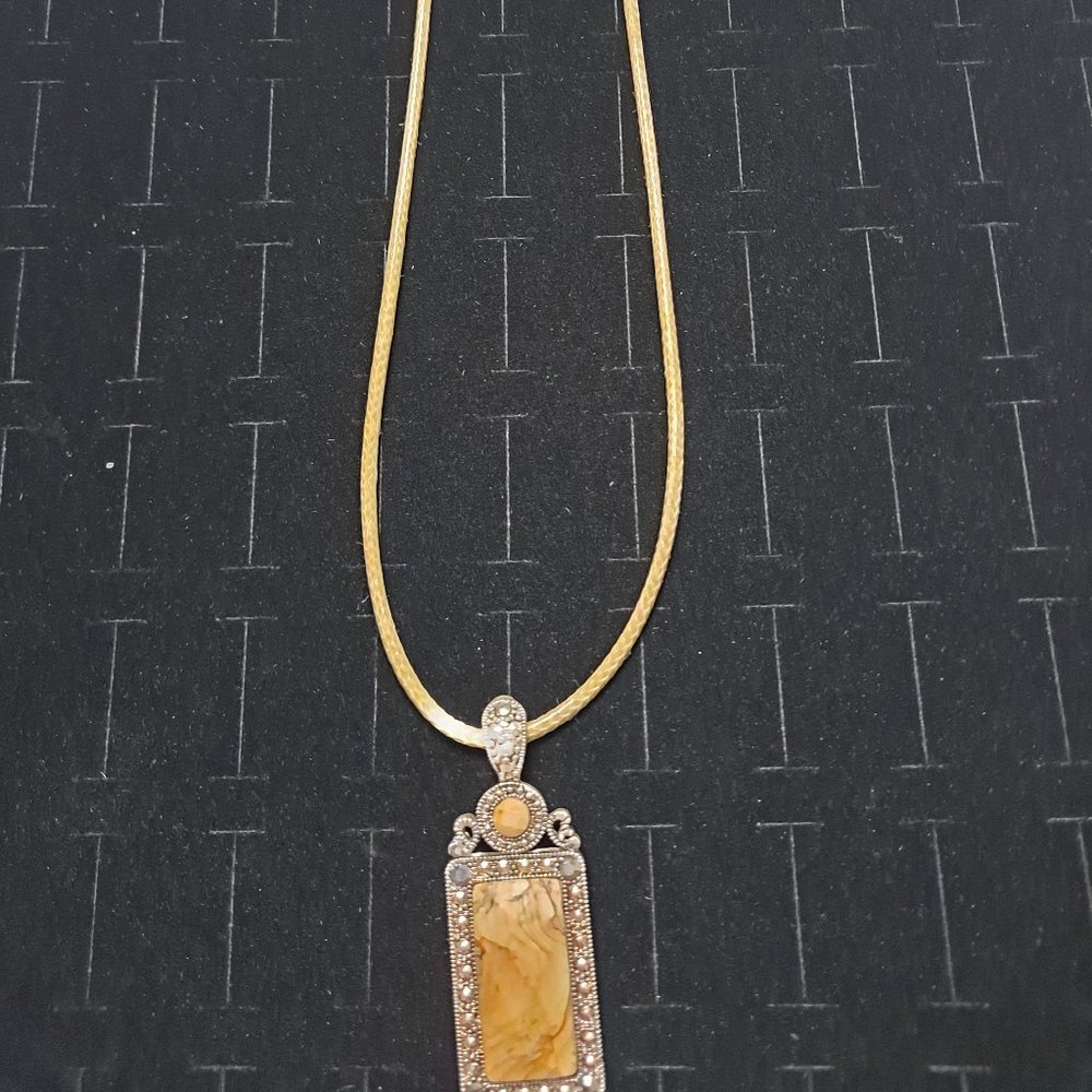 Beige leather "chain" and charm